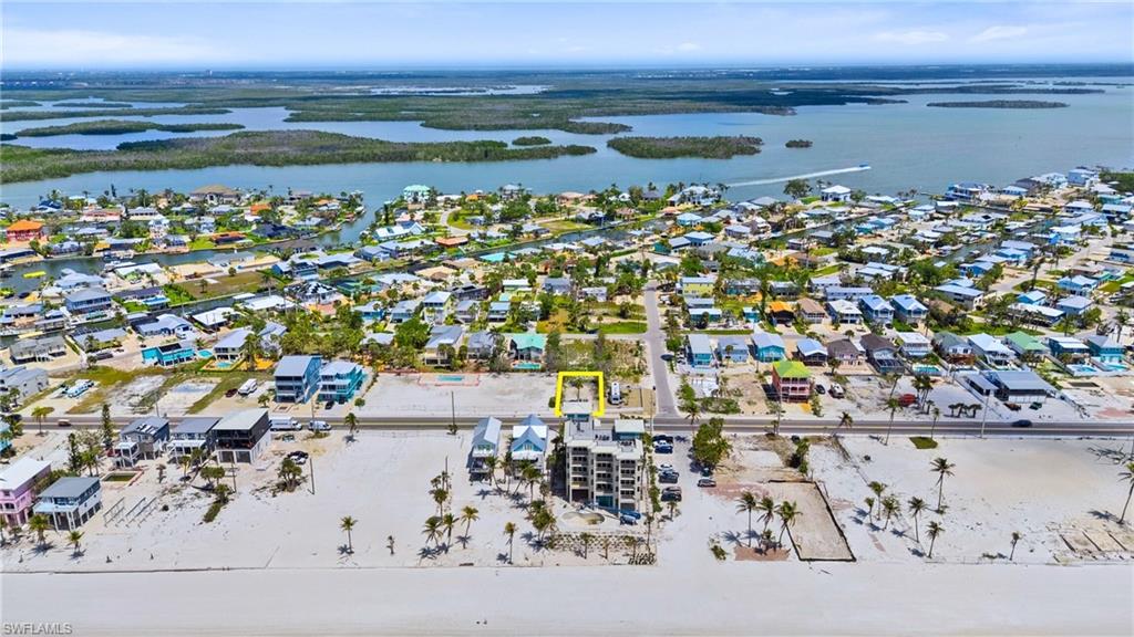 Birds eye view of property featuring a water view and a residential view- Virtually Enhanced