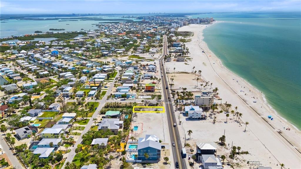 Aerial view with a view of the beach and a water view  - Virtually Edited Image