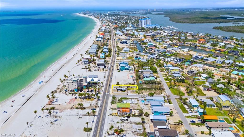 Birds eye view of property featuring a beach view and a water view  - Virtually Edited Image