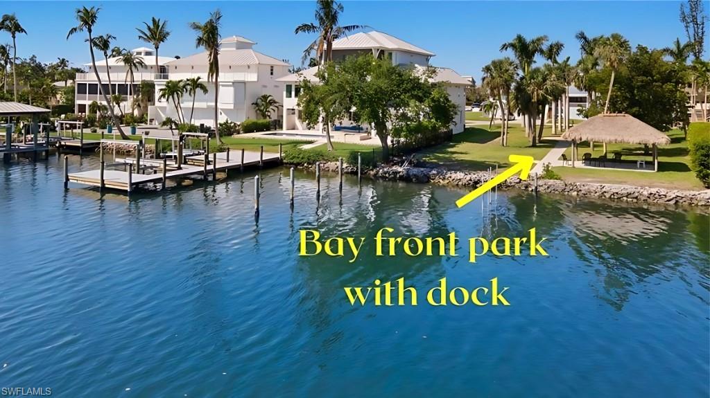 BAYFRONT PARK FOR NEIGHBORHOODWater view with a gazebo, a residential view, and a boat dock - - VIRTUALLY EDITED IMAGE