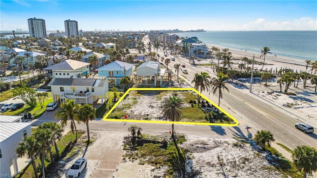 Drone / aerial view featuring a water view and a view of the beach VIRTUALLY EDITED