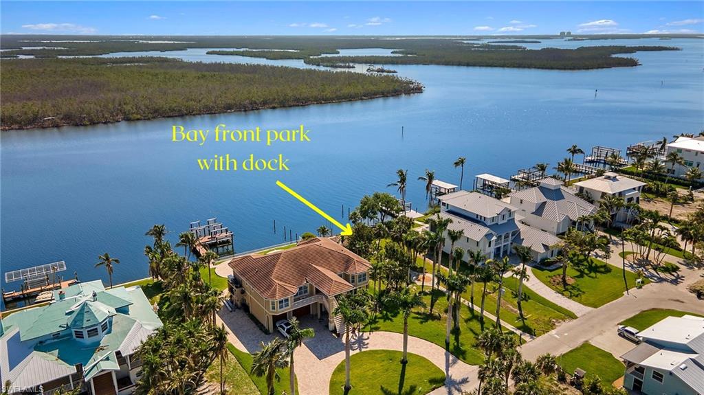 Drone / aerial view with a water view and a residential view - VIRTUALLY EDITED IMAGE