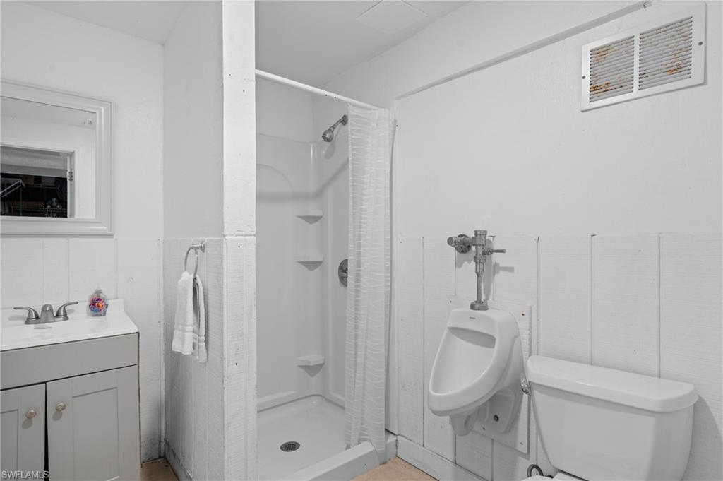 Bathroom with a walk-in shower and vanity -  - Virtually Edited Image