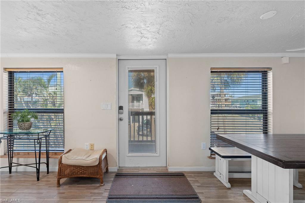 Entryway offering a glimpse of the outdoors and easy access to the deck area - Virtually Edited Image