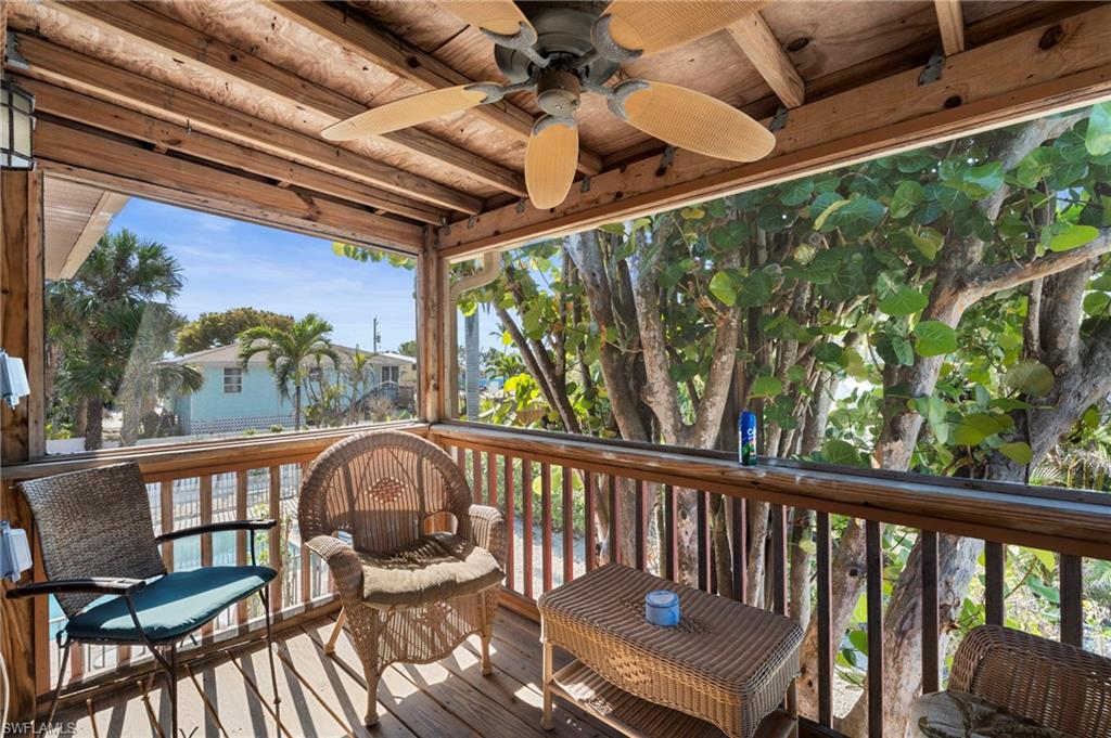 Screened-in porch —perfect for relaxing in the shade while enjoying the lush, tropical surroundings  - Virtually Edited Image