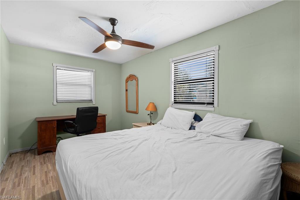 Bedroom with a dedicated workspace by the window - Virtually Edited Image