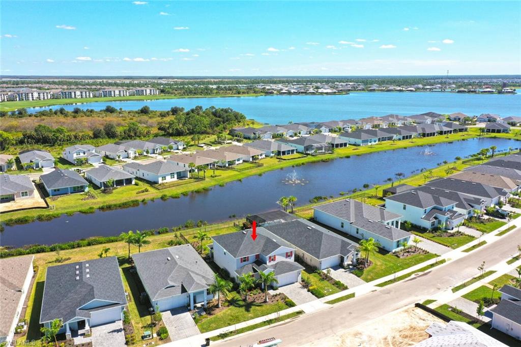 Expansive lakefront lot on Preservation Way with spacious 4,085+ sq ft of modern luxury living.