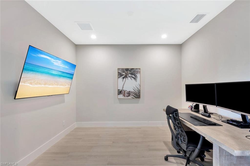 Private office/den on main level—ideal for remote work, study, or a quiet creative space.