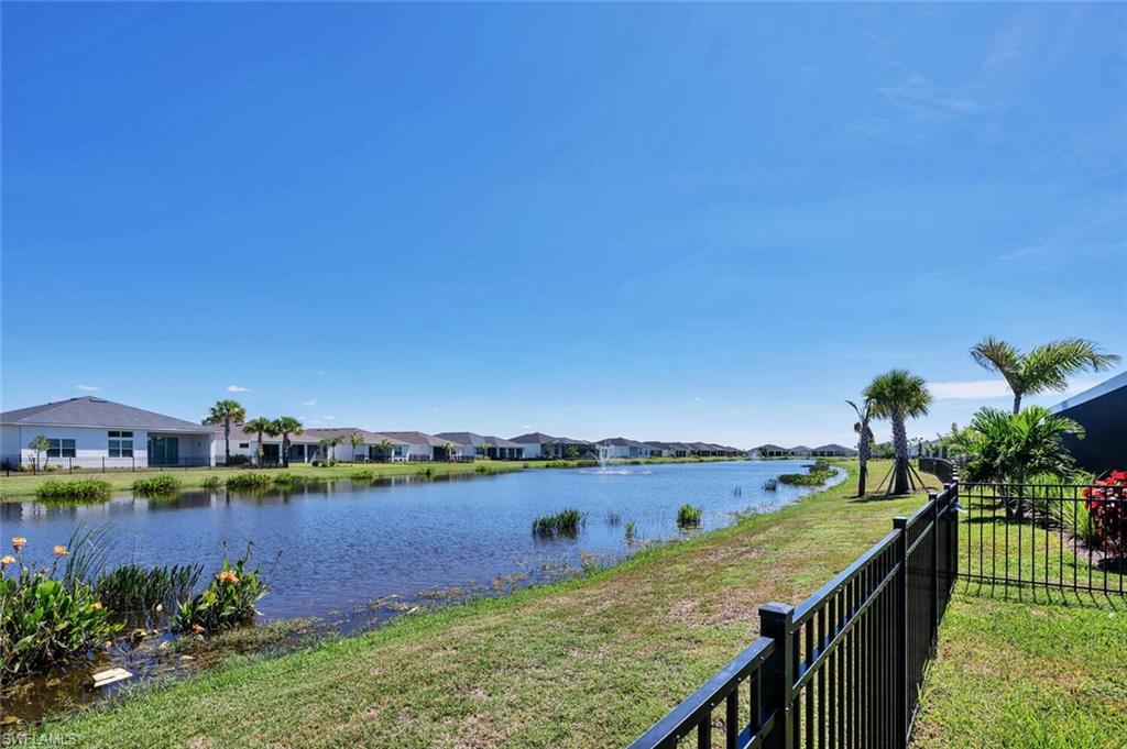 Expansive fenced east-facing yard with serene lake views—perfect for your dream pool and pets.