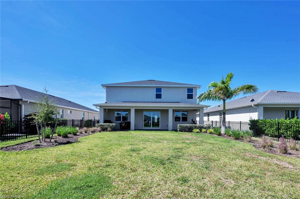 Expansive fenced east-facing yard with serene lake views—perfect for your dream pool and pets.