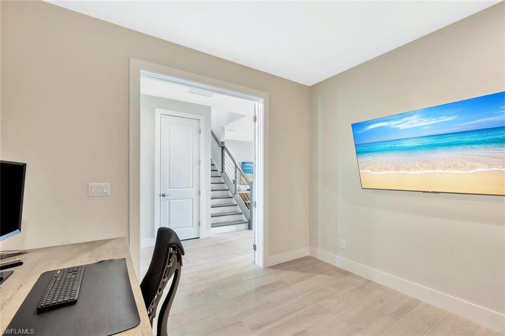 Private office/den on main level—ideal for remote work, study, or a quiet creative space.