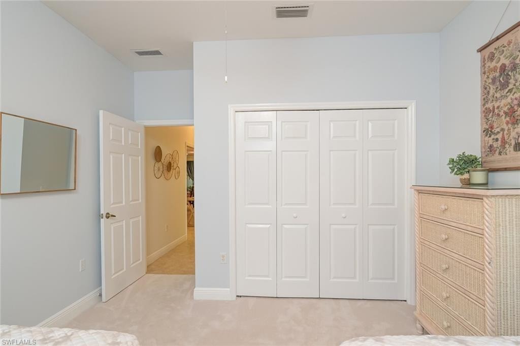 Dresser and closet in double bedroom
