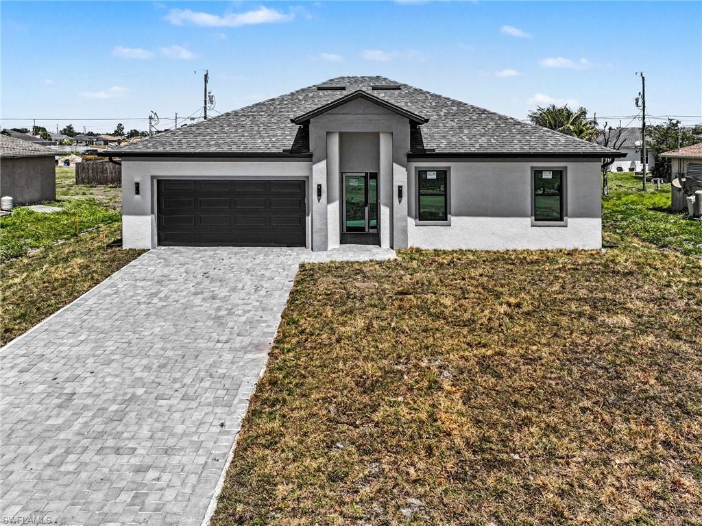 Contemporary single-story residence with a dark asphalt shingle roof