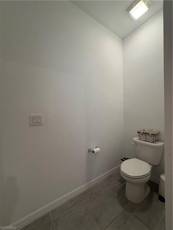 White toilet with ceramic tank