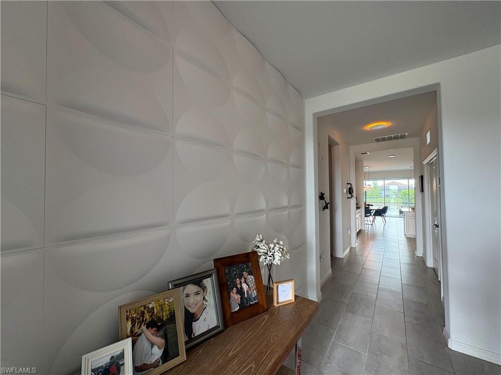 Textured accent wall featuring a modern circular pattern