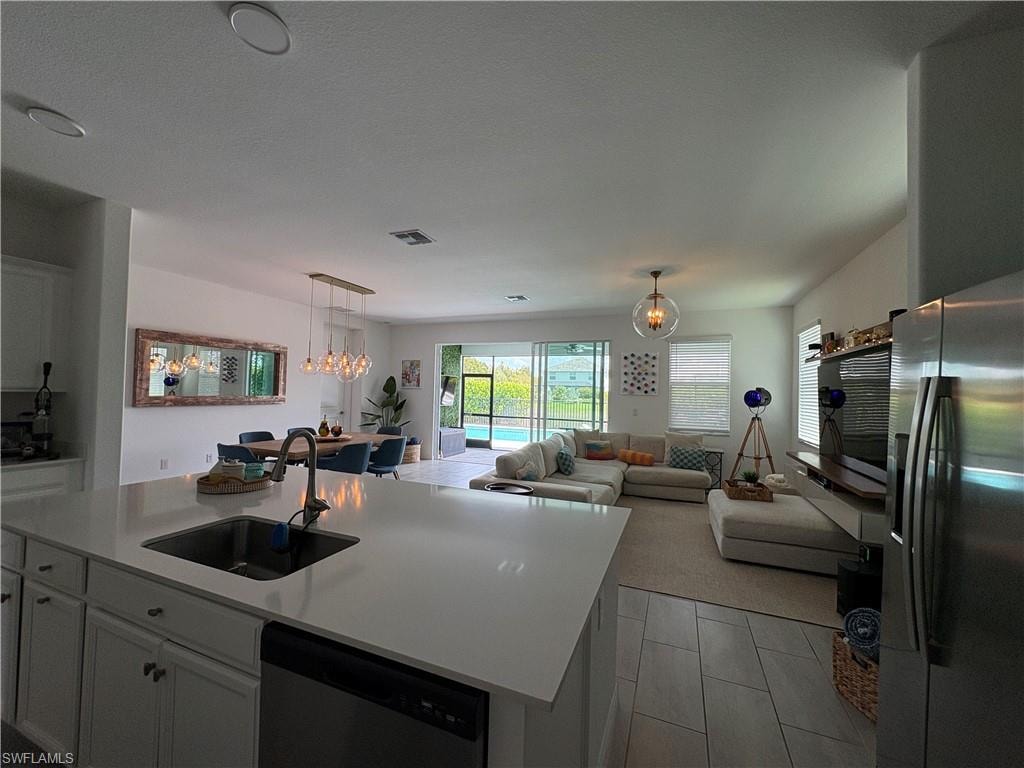 Kitchen island with an undermount sink and a gooseneck faucet