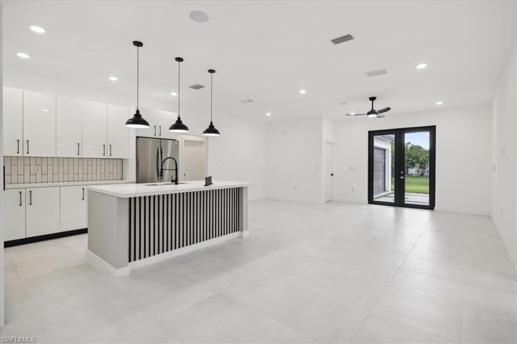 Living room with recessed lighting and ceiling fan