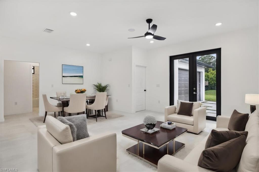 Unfurnished room with ceiling fan, recessed lighting, and french doors