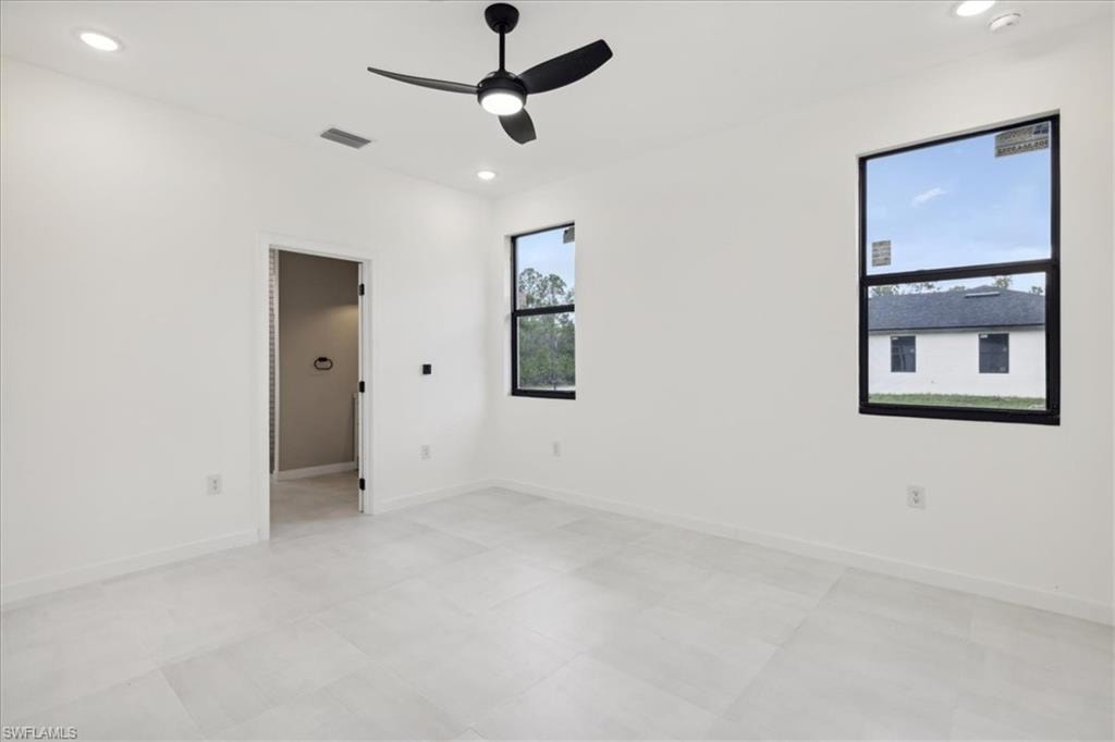 Bathroom featuring plenty of natural light and tile patterned flooring
