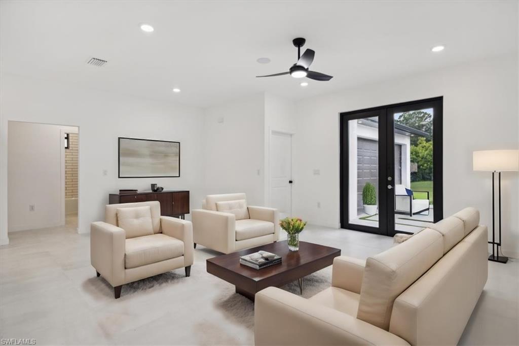 Empty room featuring a ceiling fan, a smoke detector, and recessed lighting