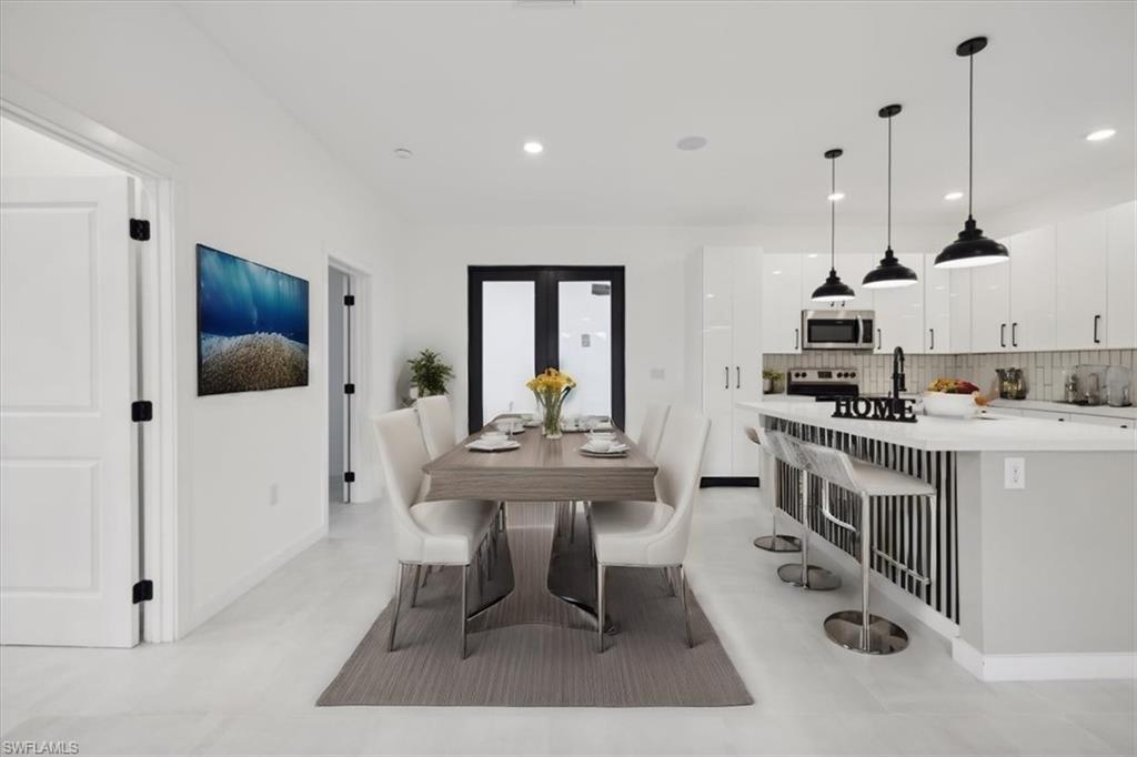 Empty room with a ceiling fan and recessed lighting