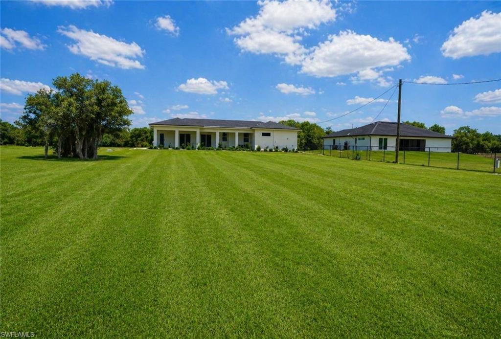 Expansive green lawn.Image digitally enhanced and virtually altered; actual property condition may differ.