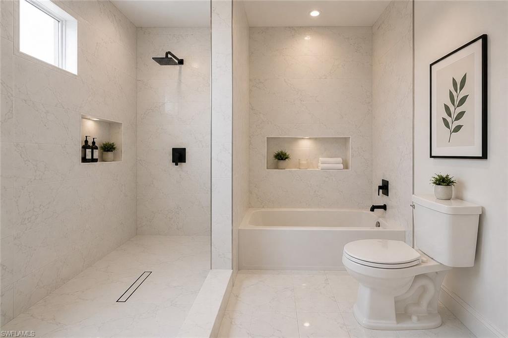 Contemporary bathroom featuring full-height marble-look tile, a frameless glass shower enclosure, a recessed shower niche with integrated lighting, a rain shower head, and a bathtub with matte black fixtures