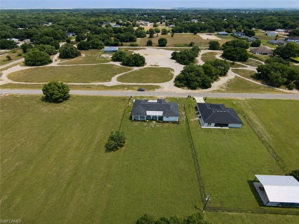 Expansive grassy parcel. Image digitally enhanced and virtually altered; actual property condition may differ.