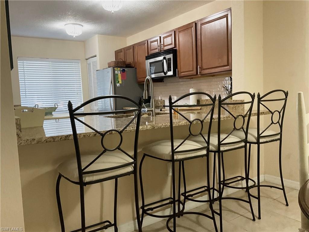 Kitchen Area with bar stools