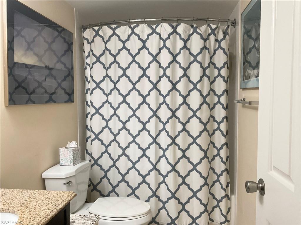 Guest bathroom with tub/shower, vanity & toilet