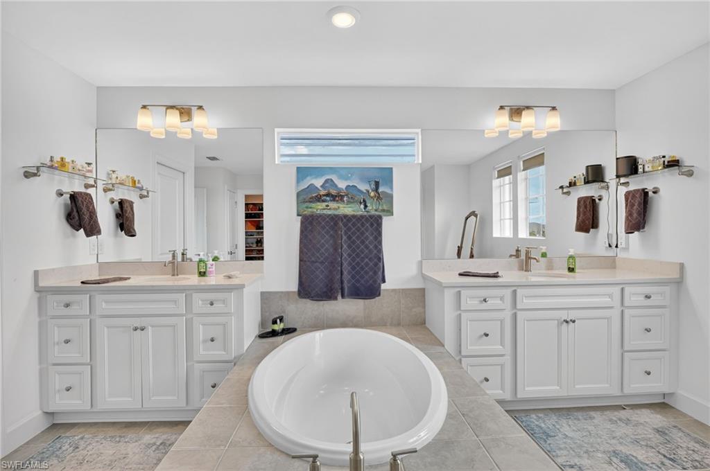 Primary Bathroom spacious dual sinks and separate shower tub.