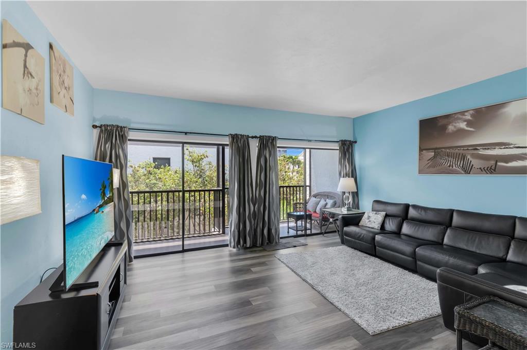 LIVING ROOM & SCREENED BALCONY