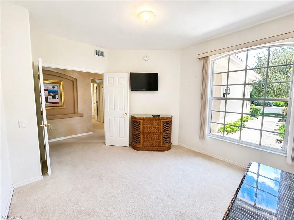 Versatile guest room ideal for a home office or hobby space.