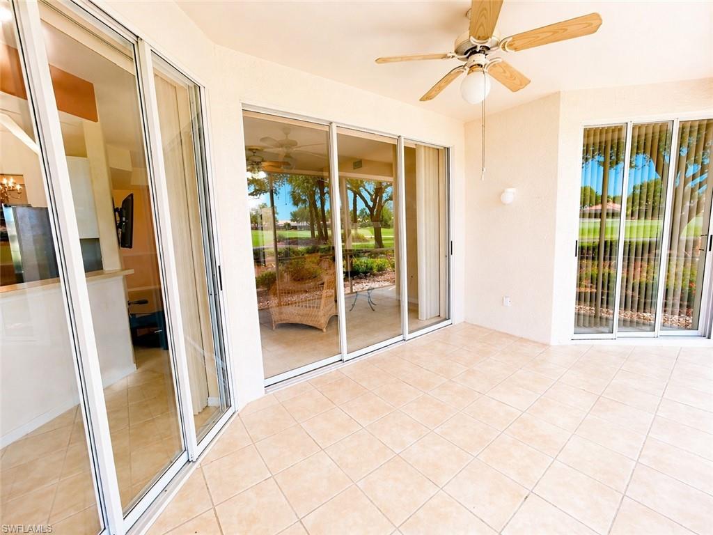 Screened lanai offering peaceful golf course and landscaped views.