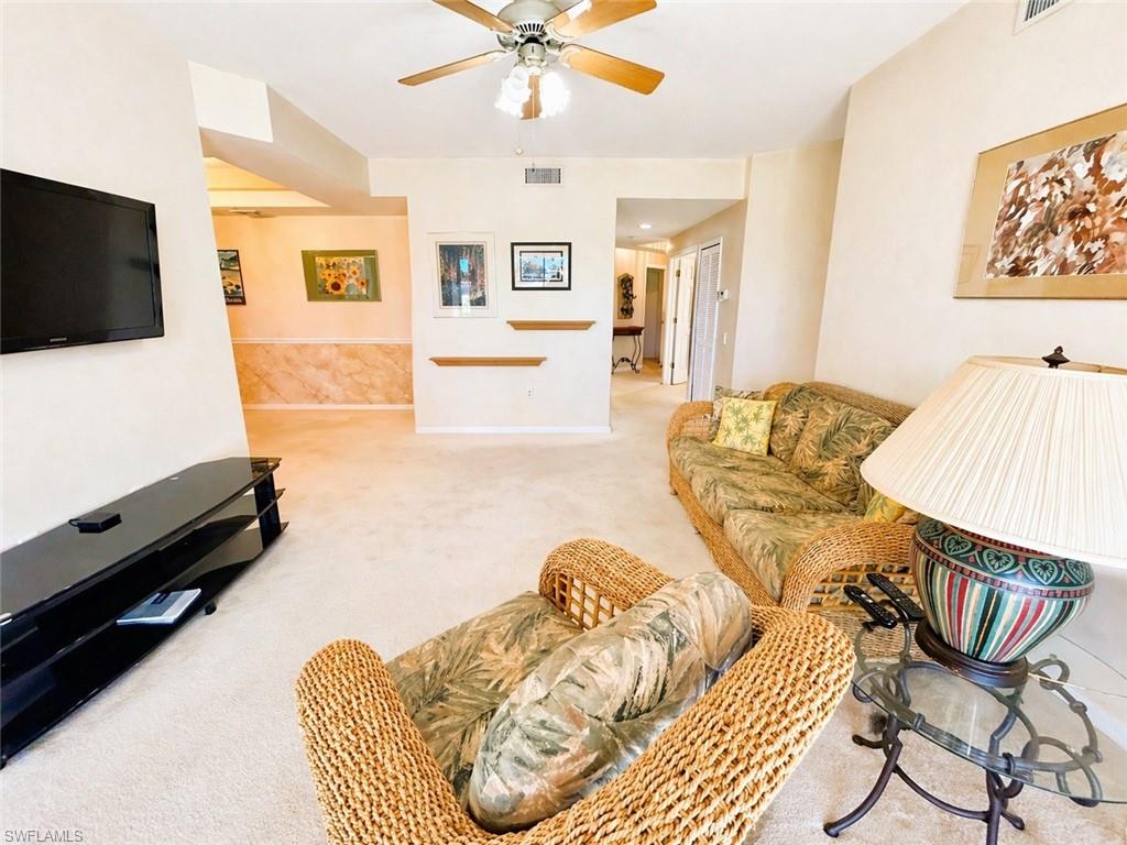 Spacious main living space with neutral finishes and seamless flow to the lanai.