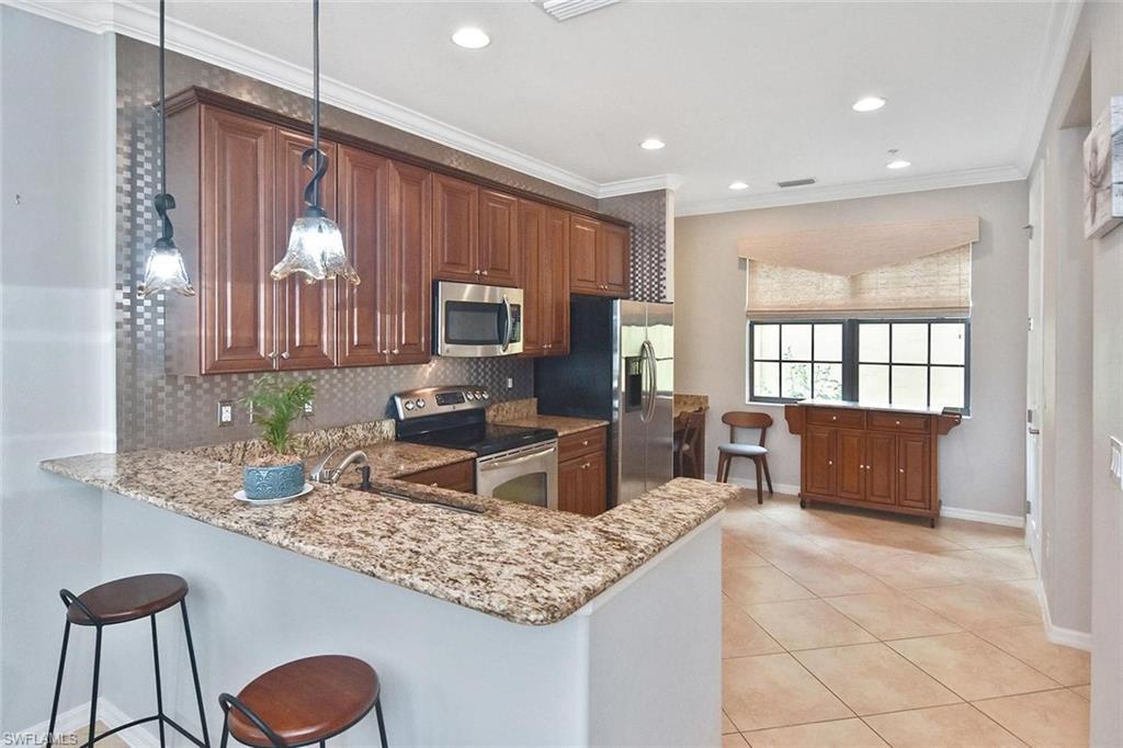 A breakfast bar is a great place to keep the cook company!