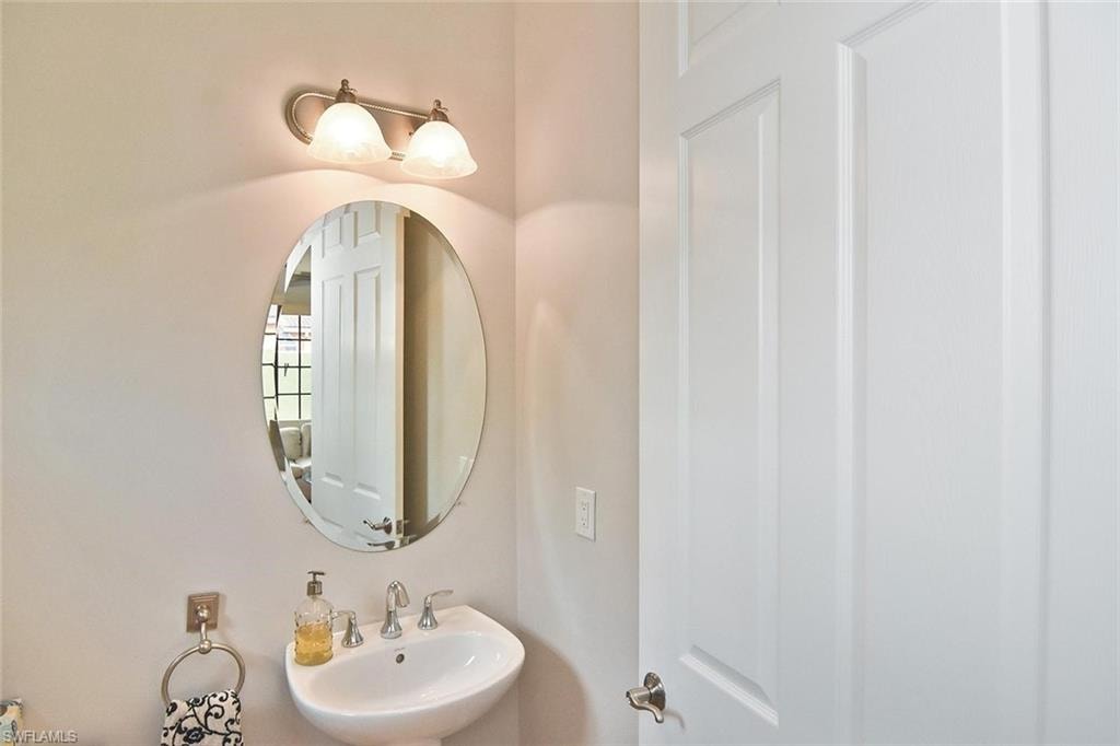 A convenient half-bath serves the home's ground level.