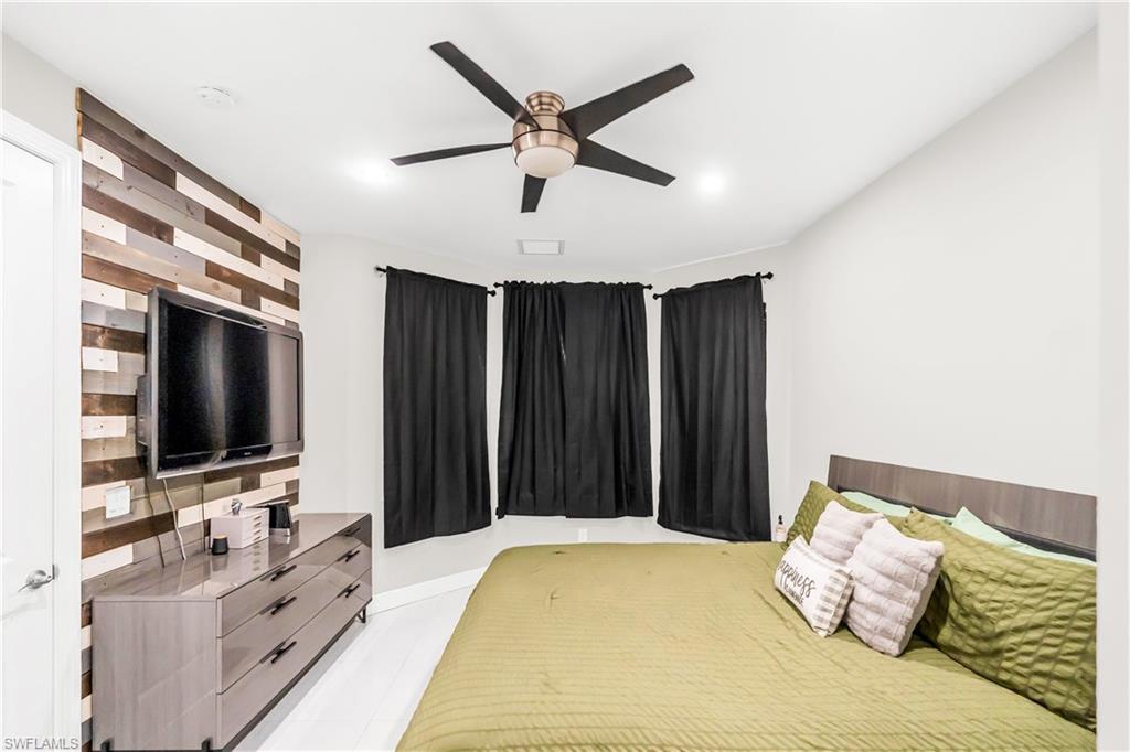 Owner's Bedroom  with Accent wall with horizontal wood planks