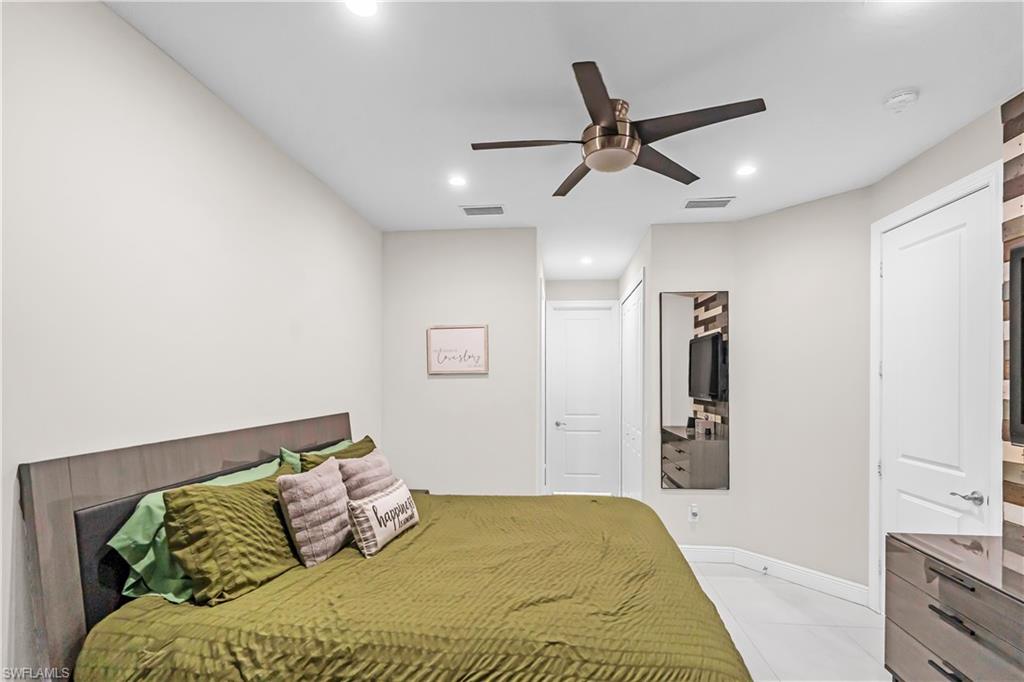 Owner's Bedroom featuring a contemporary ceiling fan, recessed lighting, and a paneled accent wall