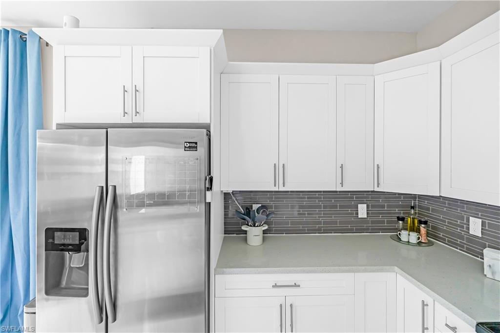 White shaker-style cabinetry with brushed nickel hardware