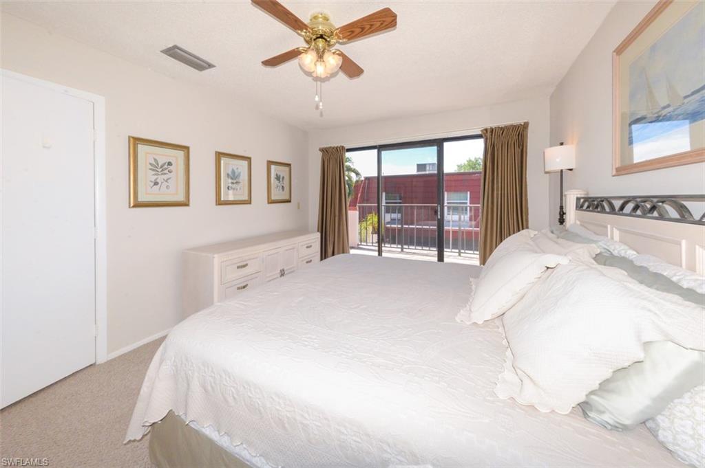 Large Primary Bedroom shows sliding glass doors to Private Balcony to the left.