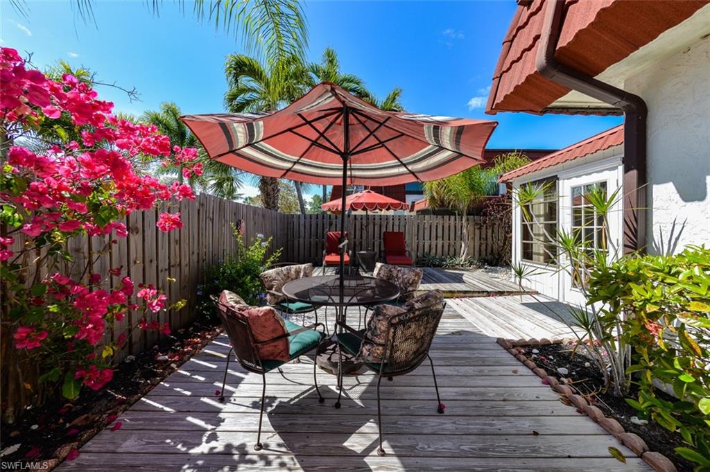 Townhome features a Large Private Courtyard with Patio Tables, Umbrellas and lounge chairs. Your Private Slice of Paradise in the Sun! Lovely Heated Pool is just steps from your gate !