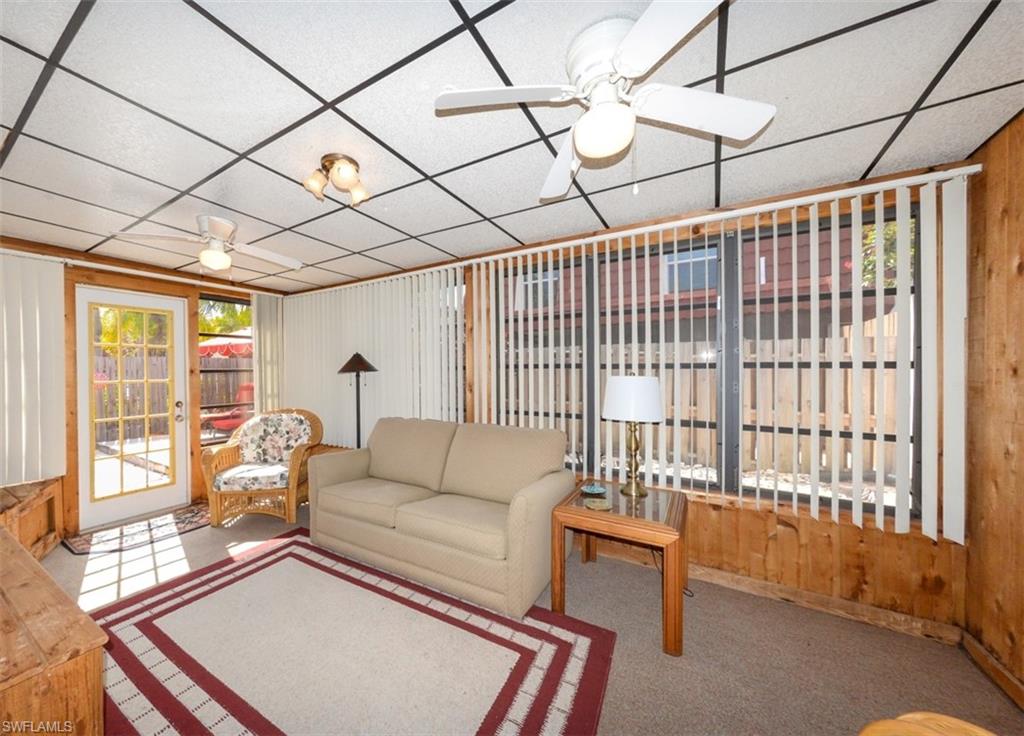 Large Florida Room Shows all the lovely natural light from the windows and leads to the Private Courtyard.