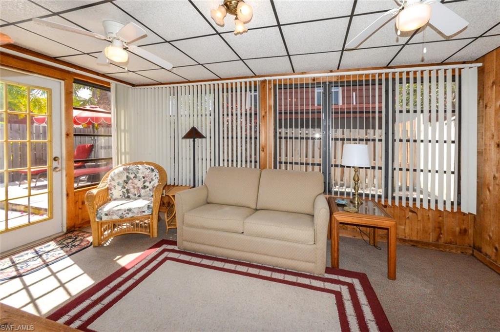 Large Florida Room Shows all the lovely natural light from the windows and leads to the Private Courtyard.