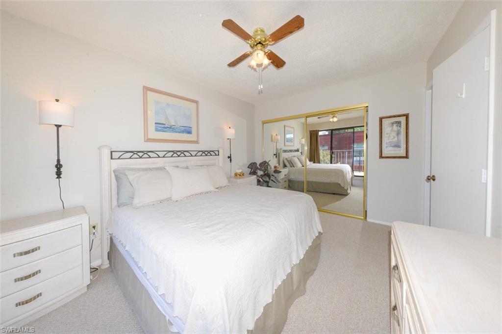 Large Primary Bedroom looking toward the wall to wall closet & door to right leading to primary bathroom