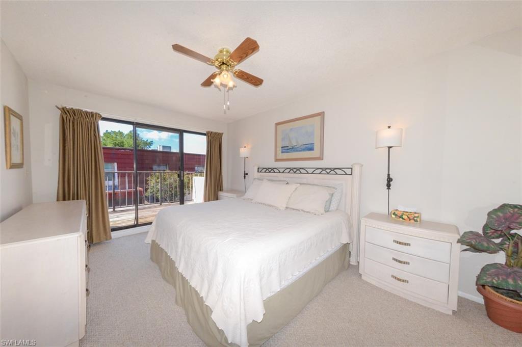 Large Primary Bedroom shows sliding glass doors to Private Balcony to the left.