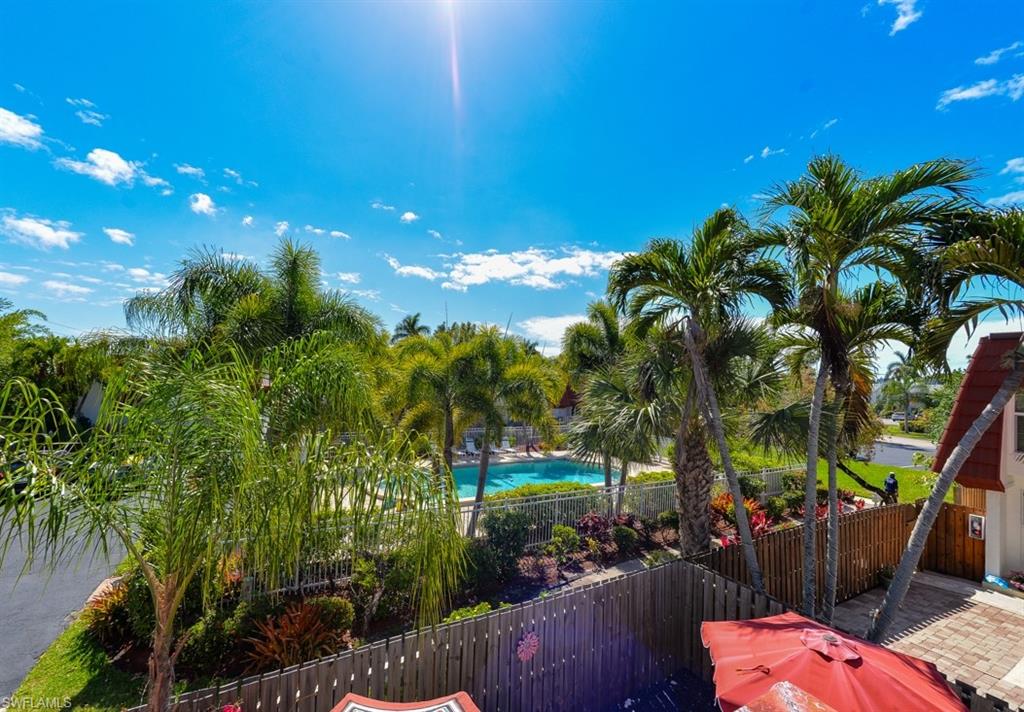 Private Balcony off the primary bedroom. Overlooks the private courtyard and views of the Pool that is just steps away from your townhome.