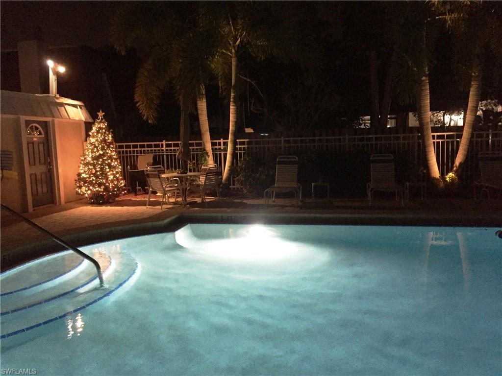 Enjoy an Evening by the Tropical Landscaped Heated Pool! The pool is just steps from your Private Gated Courtyard.