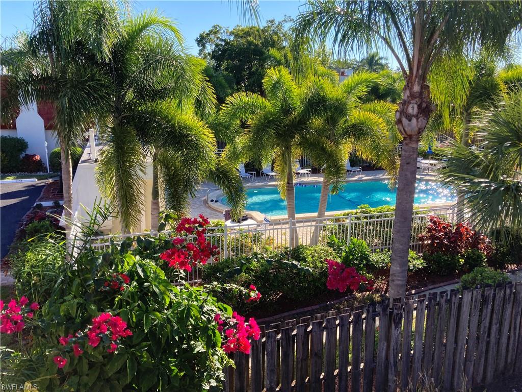 Private Balcony off the primary bedroom. Overlooks the private courtyard and views of the Pool that is just steps away from your townhome.