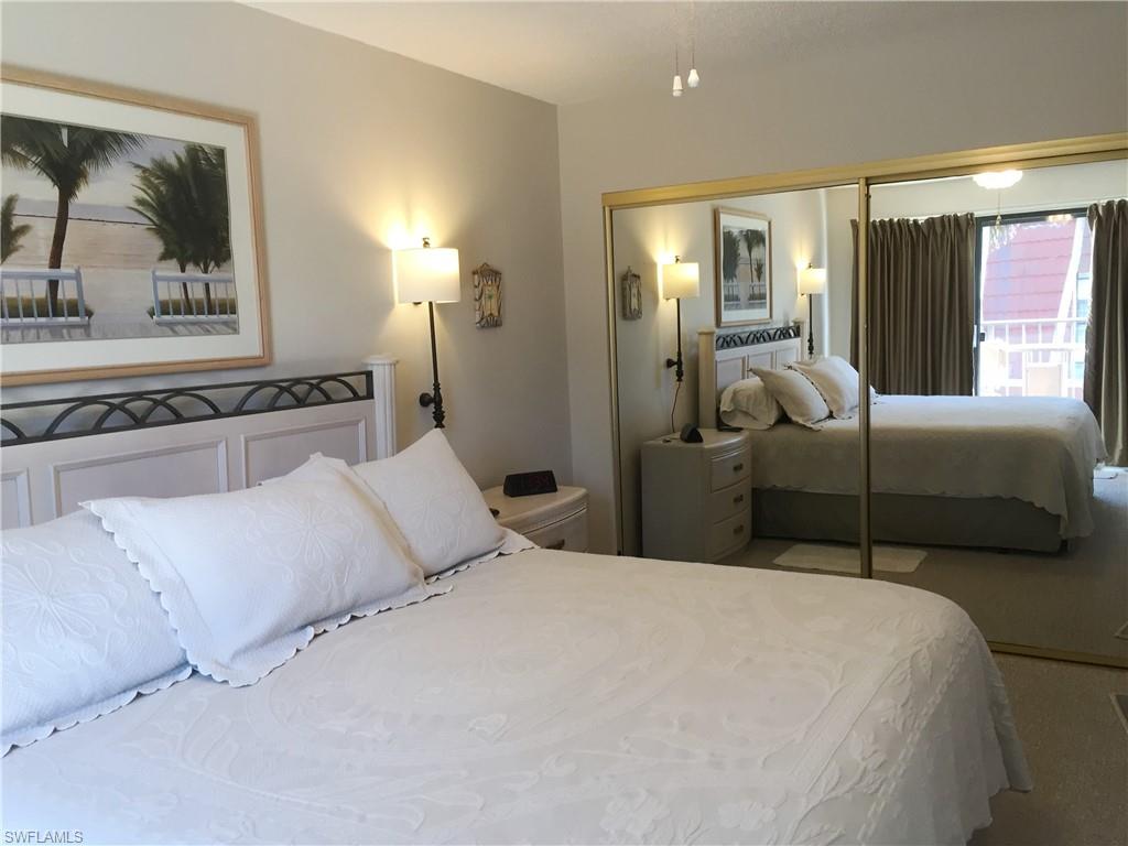 Large Primary Bedroom looking toward the wall to wall closet & door to right leading to primary bathroom